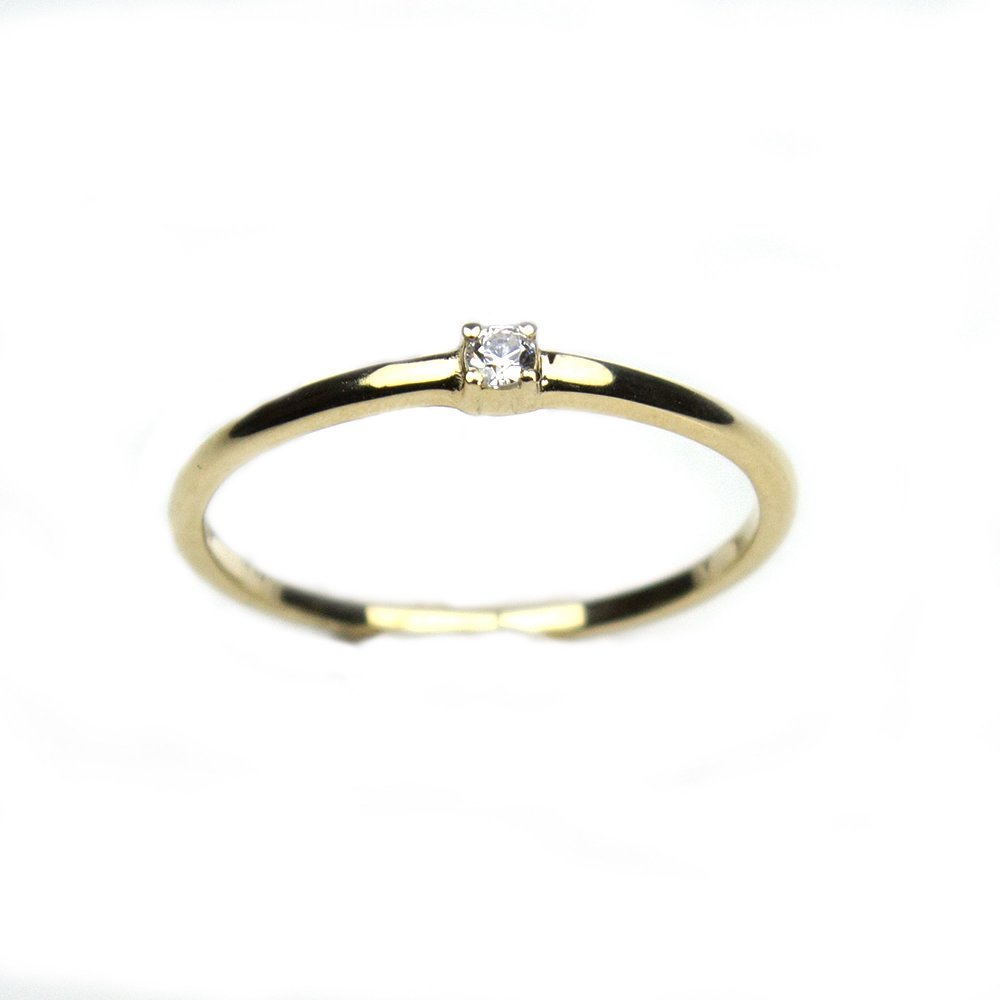 K9 gold ring with white zircons