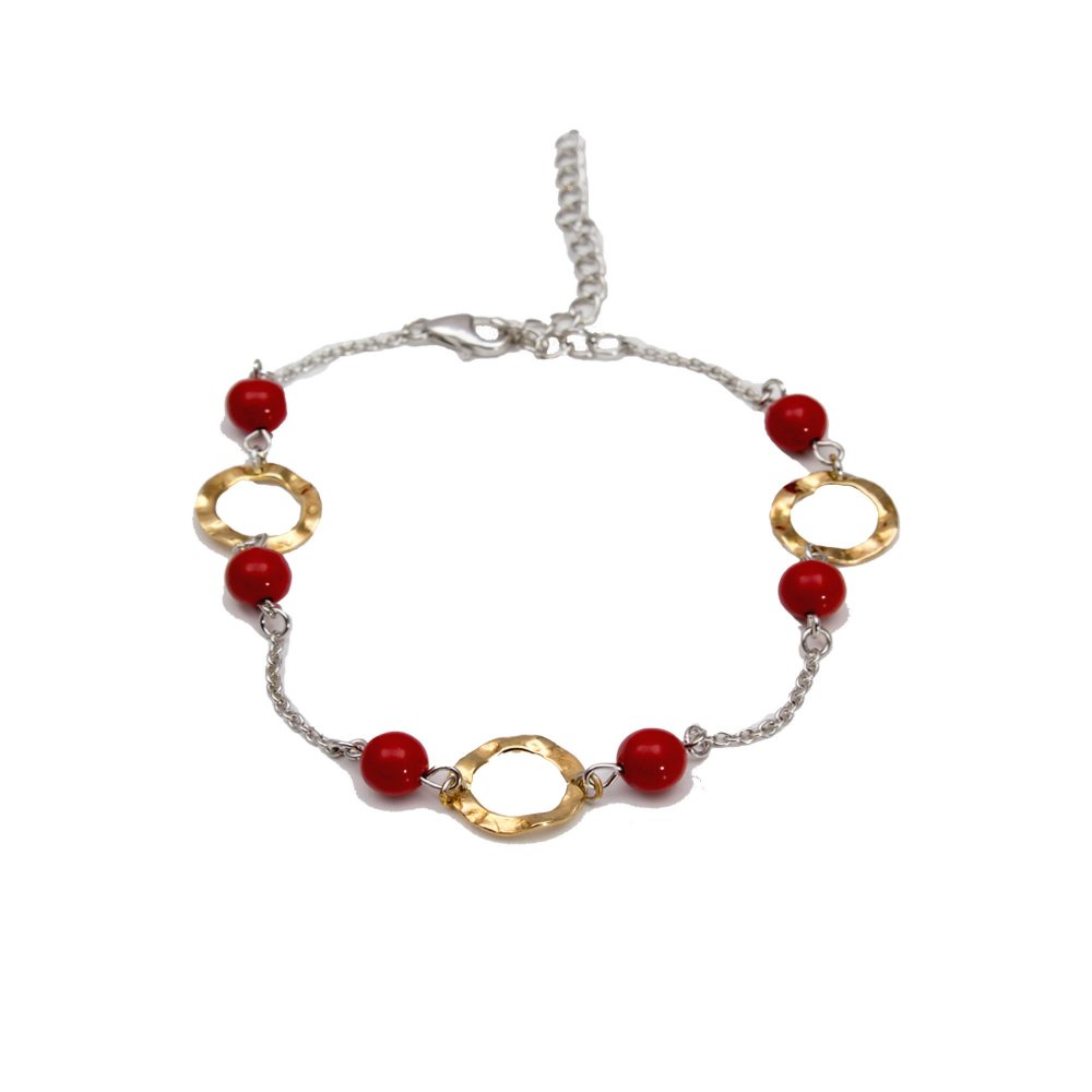 Silver bracelet with coral stones and round motifs